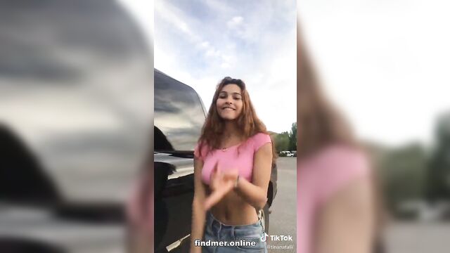 Walking around braless in a pink top