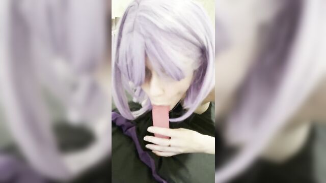 A girl in a purple wig plays with her tits and dildo