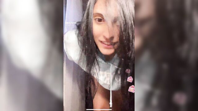 A girl had a nip slip accident while driving her car