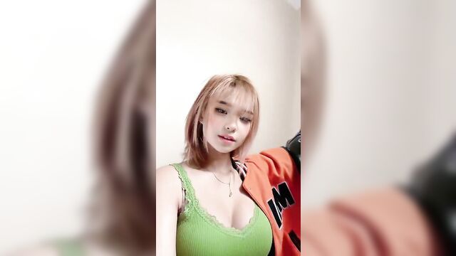 Asian girl with big boobs playing with her pussy