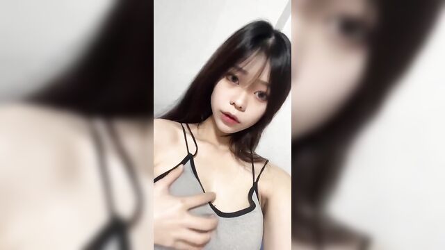 Petite asian teen xiniii gets naked on camera