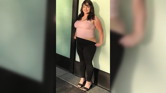 An ai model strips down to show its body in a very short dress