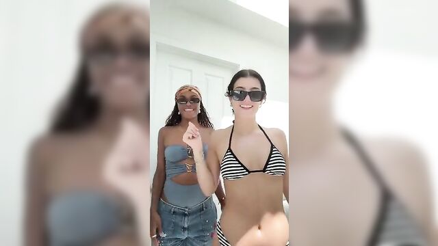 Charli d’amelio in a sexy white and black striped bikini