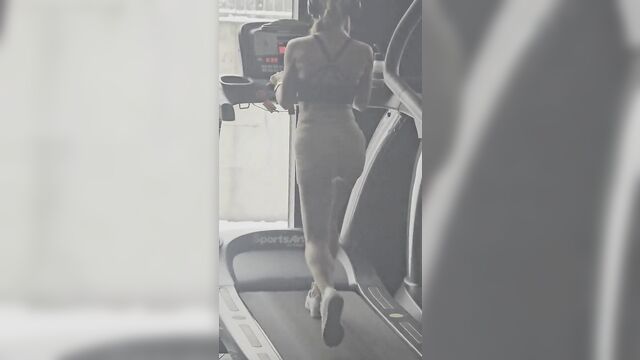 A hot milf is training in the gym and getting sweaty