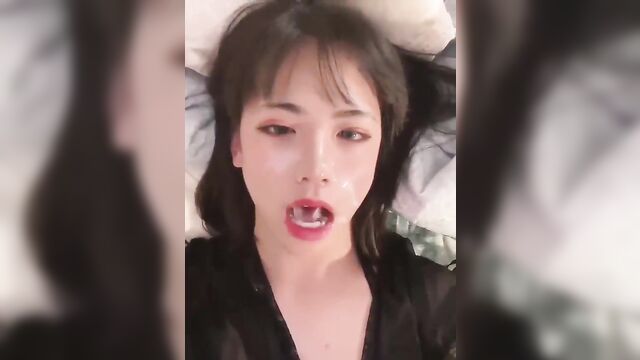 Asian slut gets her face covered with cum after giving a deepthroat blowjob