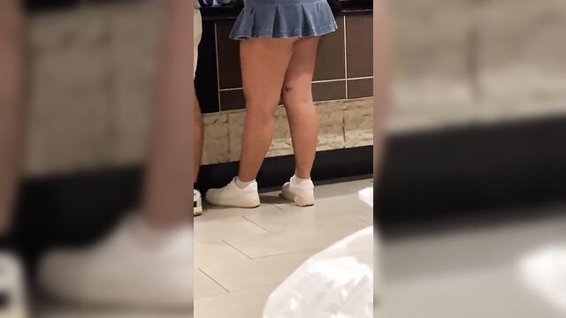 A hot petite asian woman flashed her pussy in the mall wearing a mini skirt