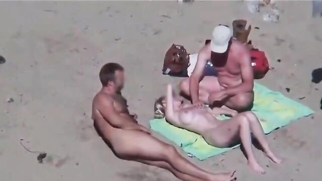 Crazy threesome sex on the public beach
