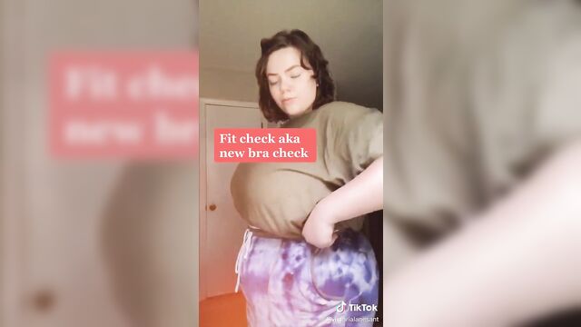 A fat woman with huge boobs is having an intense experience