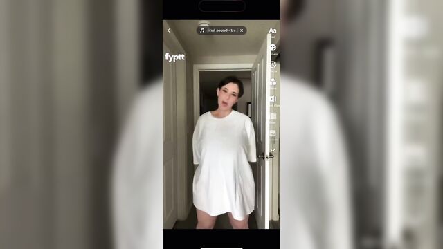 A girl with big tits is dancing on tiktok and showing her boobs