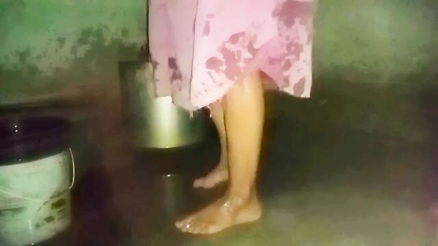 Indian aunty bathing in village home